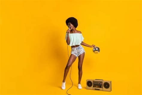 Full Length Body Size Photo Of Black Skinned Girl Singing With Boombox