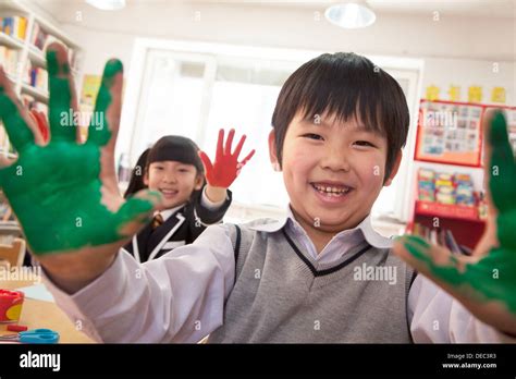 School Children Showing Their Hands Covered In Paint Stock Photo Alamy