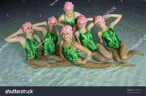 Synchronized Swimmers Hold Pose For Camera Stock Photo 47030173