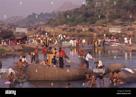 People Bathing In The Tungabhadra River Hampi Karnataka India Stock