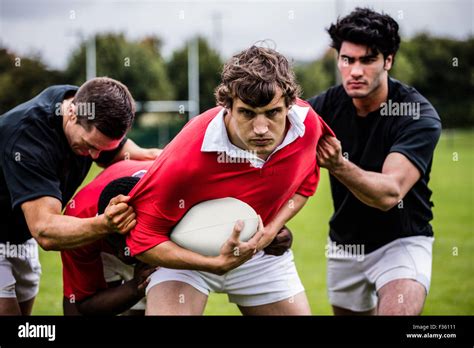 Rugby Players Tackling During Game Stock Photo Alamy