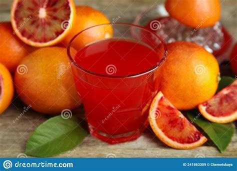 Tasty Sicilian Orange Juice In Glass And Fruits On Wooden Table Stock