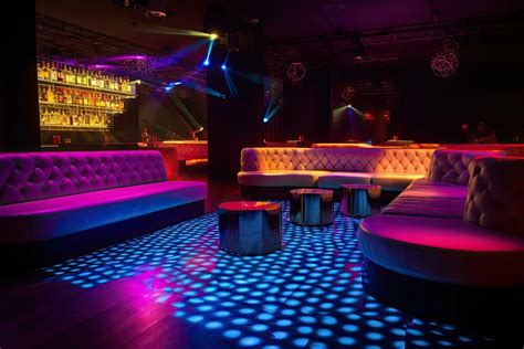 Colorful Interior Of Bright And Beautiful Night Club With Dark Seats And Glowing Lights A