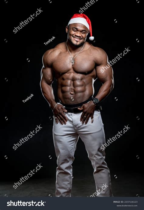 Photo de stock Le Père Noël musclé à moitié 2237116123 Shutterstock