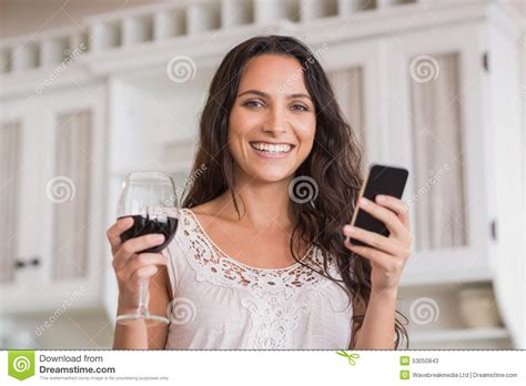 Pretty Brunette Using Smartphone And Having Glass Of Wine Stock Image Image Of Adult Kitchen