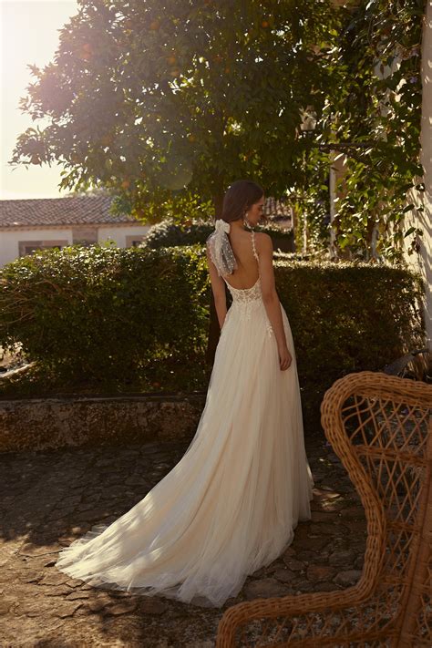 A Line Bridal Dress With Plunging Bikini Neckline And D Flowers