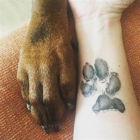 People are "Branding" Themselves with Dog Paw Tattoos