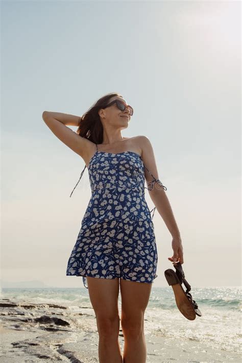 Brunette Woman In Floral Blue Dress On Rocky Beach Stock Image Image Of Escape Destination