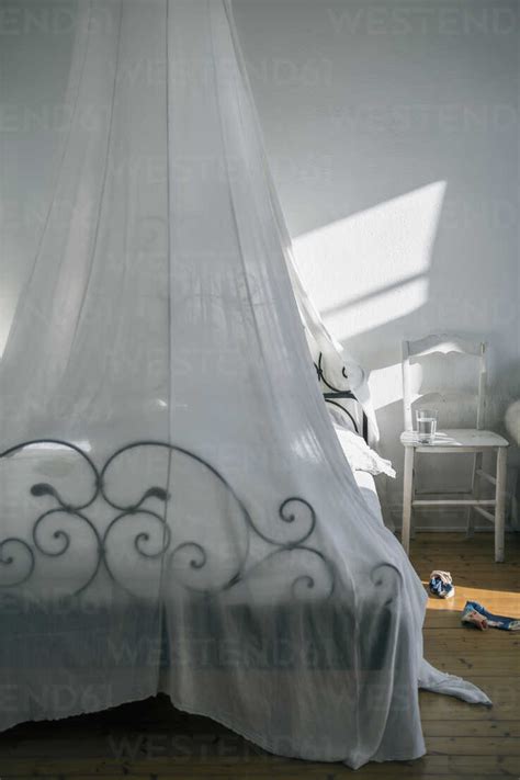 Bedroom with canopy bed stock photo