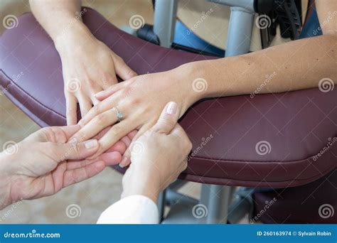 Young Woman Receiving Hand Massage In Spa Salon By Professional