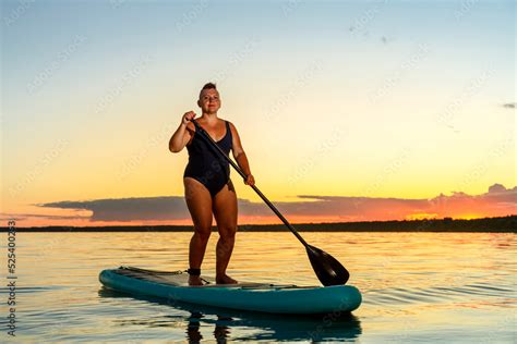 Jewish Feminist Woman In Swimsuit Shaved With Mohawk On Sup Board At