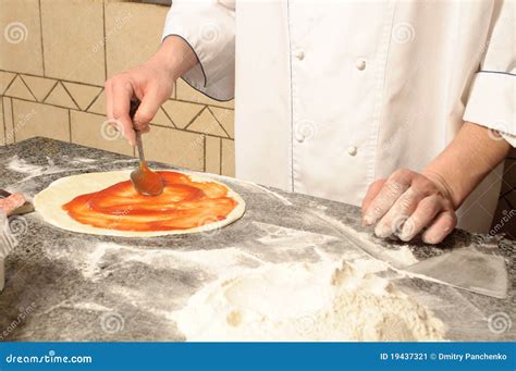 Pizza Base On The Working Electric Oven Royalty Free Stock Image