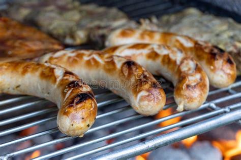 Grilled Meat On The Grill German Sausages Or Bratwurst Stock Image