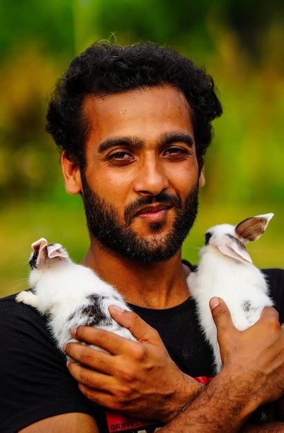 Premium Photo | Boy with cute rabbit pet animal