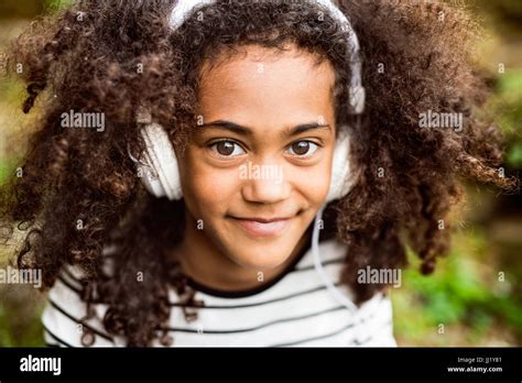 Beautiful African American Girl With Headphones Listening Music Stock