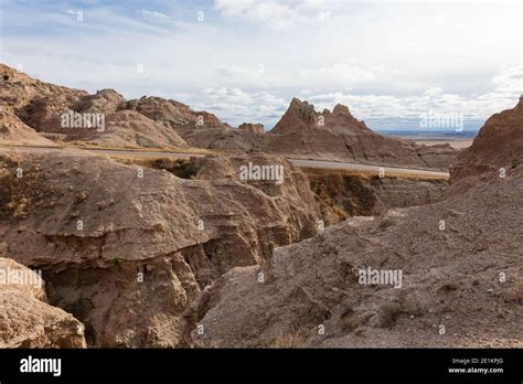 Road Through Rugged Terrain And Eroded Landscape In Badlands National