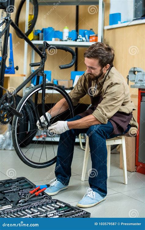 Repairing wheel of bicycle stock image. Image of toolbox - 103579587