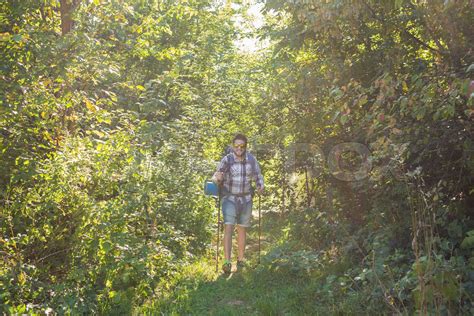 People, hike, tourism and nature concept - Man in the forest | Stock ...