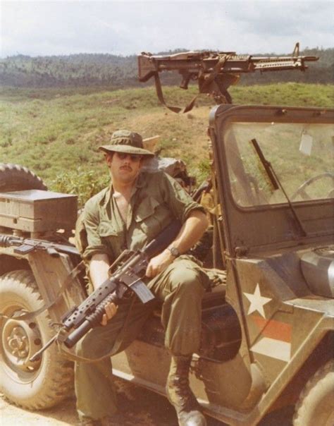 XM-148 (M16A1 with M203 40mm grenade launcher) and M60 on gun jeep. "D ...