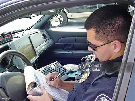 Police Officer Writing Ticket 4 High Res Stock Photo Getty Images