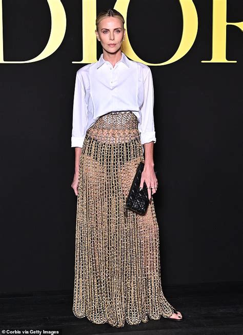 Charlize Theron shows off her age-defying features as she models a gold ...
