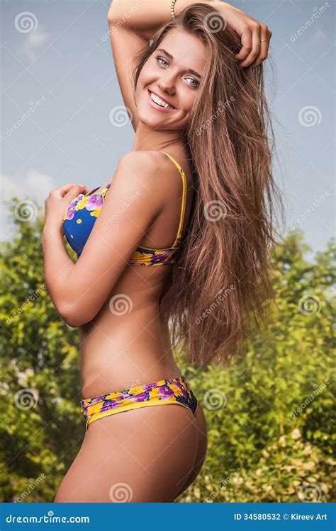 Sexual Beauty Dressed Bikini Poses In An Summer Garden Stock Photo