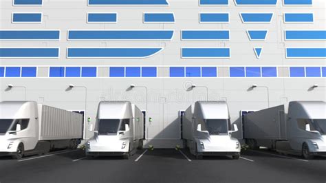 Modern Semi Trailer Trucks At Warehouse Loading Bay With Intel Logo On