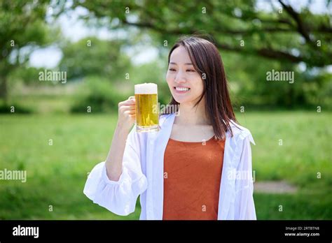Japanese Woman Drinking Beer Stock Photo Alamy