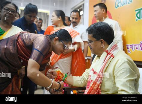 A Lady Tying Rakhi And Doing Other Rituals To Tripura Cm Professor Dr