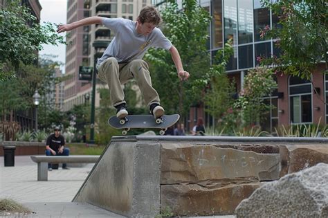 Premium Photo A Man Riding A Skateboard Up The Side Of A Ramp