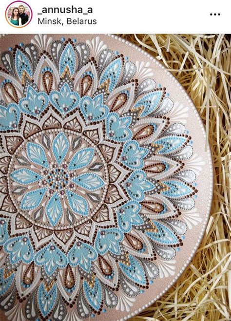 An Image Of A Blue And Brown Decorative Item On Some Straw With The