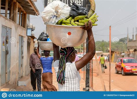 Unidentified Ghanaian Woman Carries A Basin On Her Head In Loca