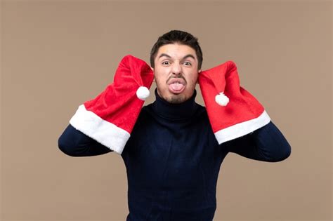 Free Photo | Front view young male with funny face, christmas holiday emotions