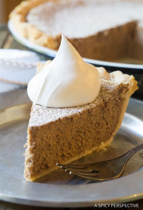 A Slice Of Pumpkin Pie With Whipped Cream On Top