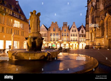 Lamberti Fountain And Gabled Houses On Prinzipalmarkt Street At Night