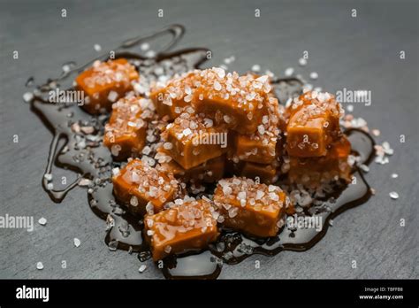 Tasty Salted Caramel Candies On Dark Background Stock Photo Alamy