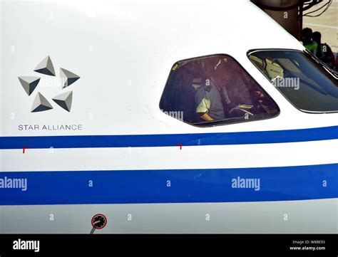 Pilots works in the cockpit of a Boeing 787-9 passenger jet of Air ...