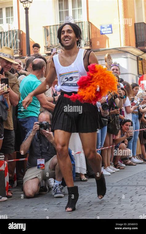 A Participant Runs During A High Heel Race As Part Of Gay Pride Month