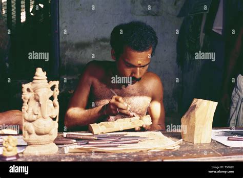 SANDALWOOD CARVER, CARVING AN IDOL OUT OF SANDALWOOD,TRADITIONAL INDIAN HANDICRAFTS, TRIVANDRUM ...