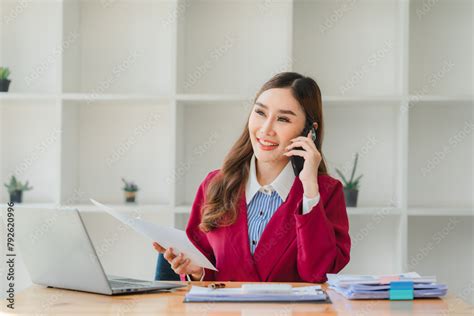 Professional Business Woman Having A Phone Call With Her Coworker About