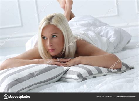 Sexy Blonde Woman Lying Bed Home Stock Photo By Racool Studio 405948042