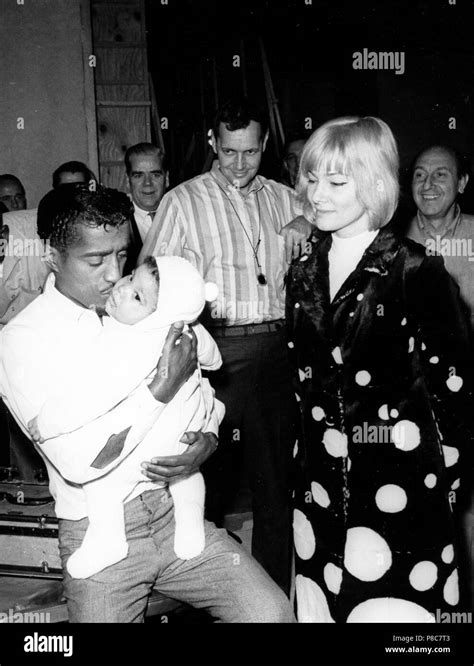 sammy davis jr with his wife may britt and their son during a break of the film shooting, a man ...