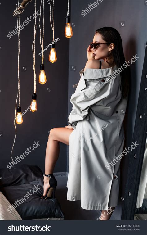 Sexy Brunette Girl Wearing Trench Coat Stock Photo