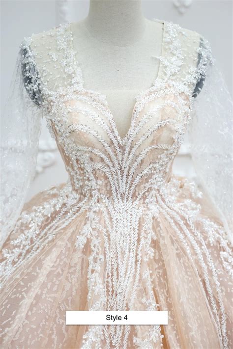 Light Nude Pink Beaded Bodice Long Sleeves Sparkle Ball Gown Wedding Dress With Short Train