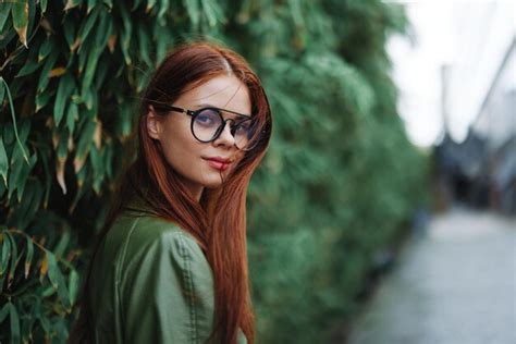 Premium Photo Portrait Of Young Woman Wearing Sunglasses Standing