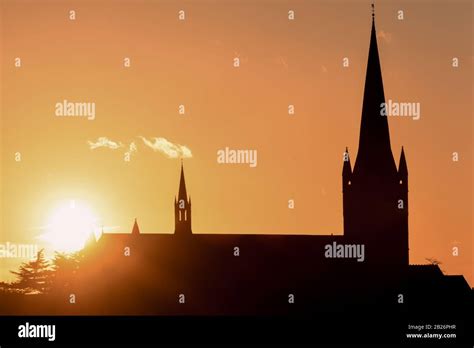 Church Building Exterior In Silhouette Of Sunrise Or Sunset With