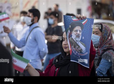 A Supporter Of Presidential Elections Candidate Ebrahim Raisi Waves An