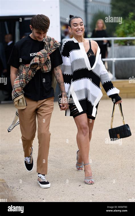 Dua Lipa and Anwar Hadid leaving the Burberry show Stock Photo - Alamy