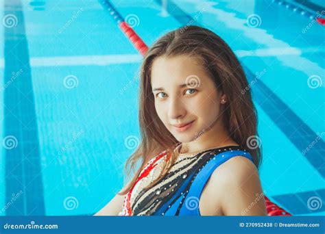 A Beautiful Young Girl Swimmer In A Beautiful Swimsuit On The