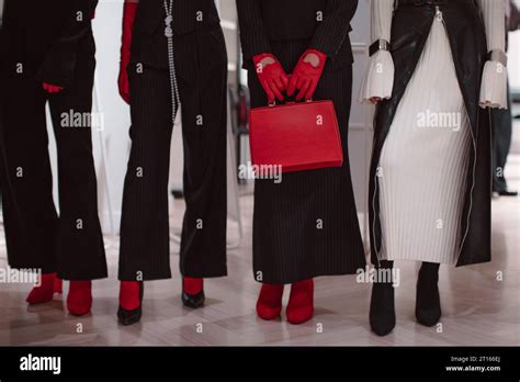 Fashion Details Of A Knitted Warm White Dress Red Leather Gloves